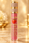 Auntie Ma's Strawberry Kiss Lip Gloss on a warm golden background