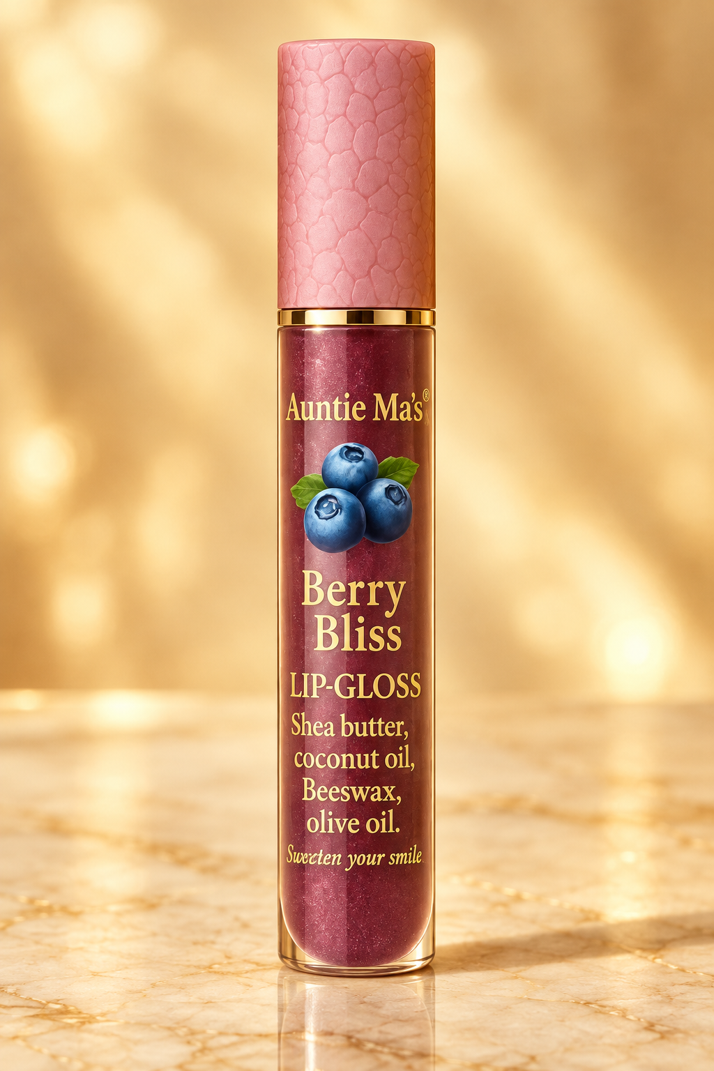 Auntie Ma's Berry Bliss Lip Gloss on a warm golden background