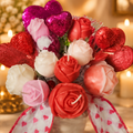Rose candle bouquet in a heart-print vase on a warm golden background